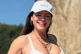 Kelly Brook's curves burst out of teeny bikini as baffled fans ask 'do you ever age'