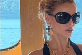 Baywatch's Brooks Nader risks spilling over risky plunging top as curves almost slip out
