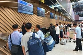 North Korean officials check Russian tourists' temperature upon arrival