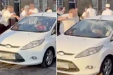 Spurs yobs attack Arsenal fans' car and hurl drinks as 'children cower inside'