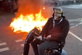 Watch: Bloke in Roman helmet on mobility scooter taunts cops during Ballymena riots