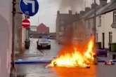 Riot police out for fourth night as fire on street and rocks thrown at cops in UK town