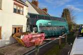 School bus horror as double decker crashes into side of house in UK village