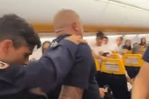 Builder 'Dan Rizz' hauled off Ryanair flight after trying to open doors in mid-air