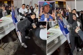 'Grieving' widow twerks on cutout of dead husband next to open casket as guests cheer