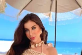 Former beauty queen dead as guilty lover found 'hanging by shorts' in prison