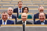 PIC OF THE DAY: Vladimir Putin has no idea what's going on around him in wild staged snap
