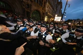 Police battle protesters shouting 'death to the IDF' as 40 arrested in UK demo chaos
