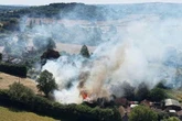 Heatwave warning given as three wildfires break out across UK with houses evacuated