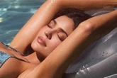 Kylie Jenner slips off g-string as she writhes on floor in just stiletto heels