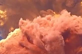 Volcano erupts sending 32,000ft tower of ash into sky as villagers flee