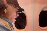Politician caught red-handed ogling adult content on plane and has classic response