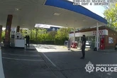 Moment brave police officer tackles man doused in petrol as he held lighter near pumps