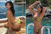 Kylie Jenner soaking wet in tiny string bikini as she showers herself on yacht