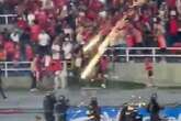 Football hooligan shoots cops with 'fireworks cannon' as hundreds invade pitch