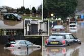 Shock New Year flood pics show Brits wading through thigh-high brown water as cars ditched