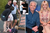 Phillip Schofield clings onto male companion as he leaves bar after failed TV comeback