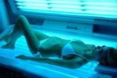 Doctors demand all sunbeds banned in UK as young women blighted by skin cancer