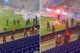 Ultras storm the pitch as fans run for cover during ugly scenes at Copenhagen derby