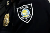 Police officer sacked after 'pointing gun' at fellow cop for microwaving smelly fish