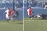 Horror moment footballer 'cheats death' and hits head against concrete wall