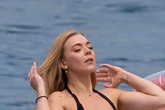 Becky Hill wows in tiny black bikini as she celebrates hen party at luxury resort