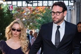 Sydney Sweeney holds hands with new boyfriend Scooter Braun as she wows in low-cut dress