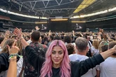 Oasis fan frenzy over pink-haired model who 'took' Wembley ticket – but she's not real