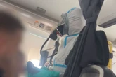 Flight 'pandemonium' as hazmat suit-clad firefighters storm British Airways plane
