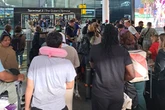 Stranded Brits sleep on airport floors after all UK flights grounded as mystery 'glitch' remains unsolved