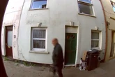 Mystery man drops trousers and takes a dump on front door as neighbours ask poo dunnit