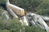 Train derailment horror as 35 cars carrying 'hazardous material' crash together sparking fire