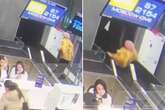 Woman sucked into airport baggage carousel after fall as staff watch on in horror