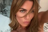 Abbey Clancy goes completely topless in steamy pics as she rolls around bed