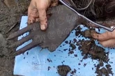 Mystery over 7,000-year-old 'six-fingered' wooden hand found in Russian bog
