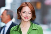 Emma Stone goes topless under sheer green jacket as she turns heads on the street
