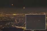 Mysterious orbs spotted hovering over major city as stunned onlooker asks 'could it be UFO?'