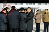 Kim Jong Un makes two officials disappear from months-old state photos prompting execution fears