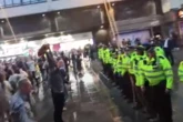 Scotland and England fans face off in London with one tackled to floor by police