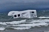 Doomed bid to save campervan swamped by sea at popular UK beach
