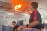 Flames burst out cabin mid-flight as battery catches fire causing emergency landing