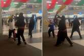 Airport brawl sees staff batter passenger with wet floor signs and rip out dreadlocks