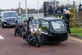 Biker takes final ride in special sidecar hearse next to dream Harley-Davidson motorcycle