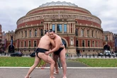 Sumo fans warned they might get squashed by massive men or hit by sand during London event