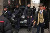 'Unusually well-dressed' man in fedora at Louvre heist scene sparks wild internet theories