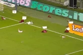 Italian football match abandoned as fans throw chairs and flares onto the pitch