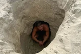 Moment Brit tourist slams beer even though he's being swallowed by sinkhole