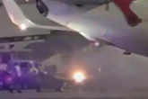 Horror plane fire as brakes catch alight just moments after touching down