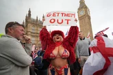 Controversial adult star says 'get them out' in tiny bikini as she joins London protests