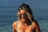 Ashley Roberts flashes sunburnt bum in thong bikini as she admits 'I never learn'